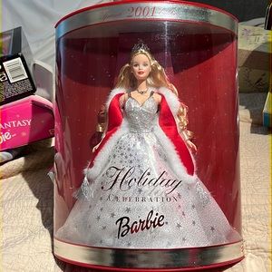 Barbie Beautiful in a silver gown with a white fur wrap trimmed in red.